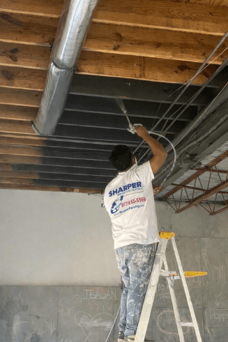 basement exposed ceiling painting during