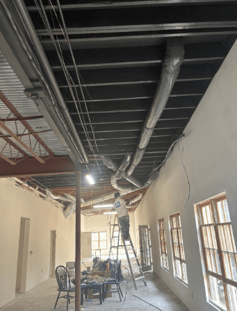 basement exposed ceiling painting during