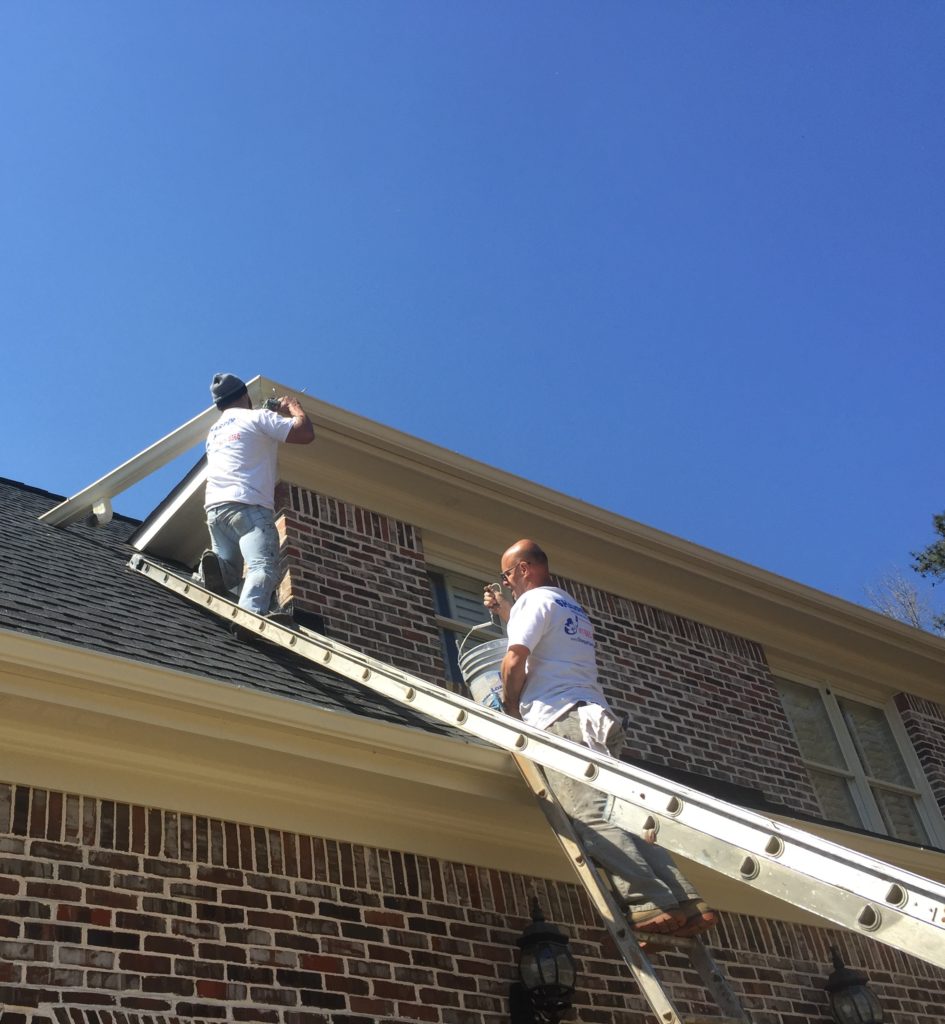 Professional Exterior Painters on Roof of House